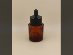 繊細なデザインの黒い小ガラス製スポイトボトル（顔用美容液用）