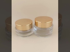 女性用ローションのための金色の螺栓蓋付きの透明ガラスクリームボトル